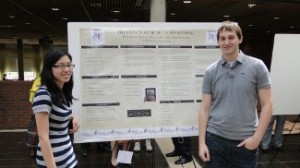 Students standing next to their poster