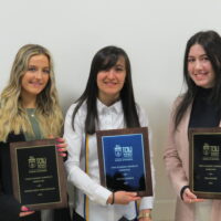 3 Students at the school of business academic award