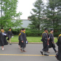 TCNJ students walking after commencement