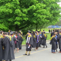 TCNJ Students in groups after commencement