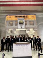 A large group of people standing next to each other at the New York Stock Exchange