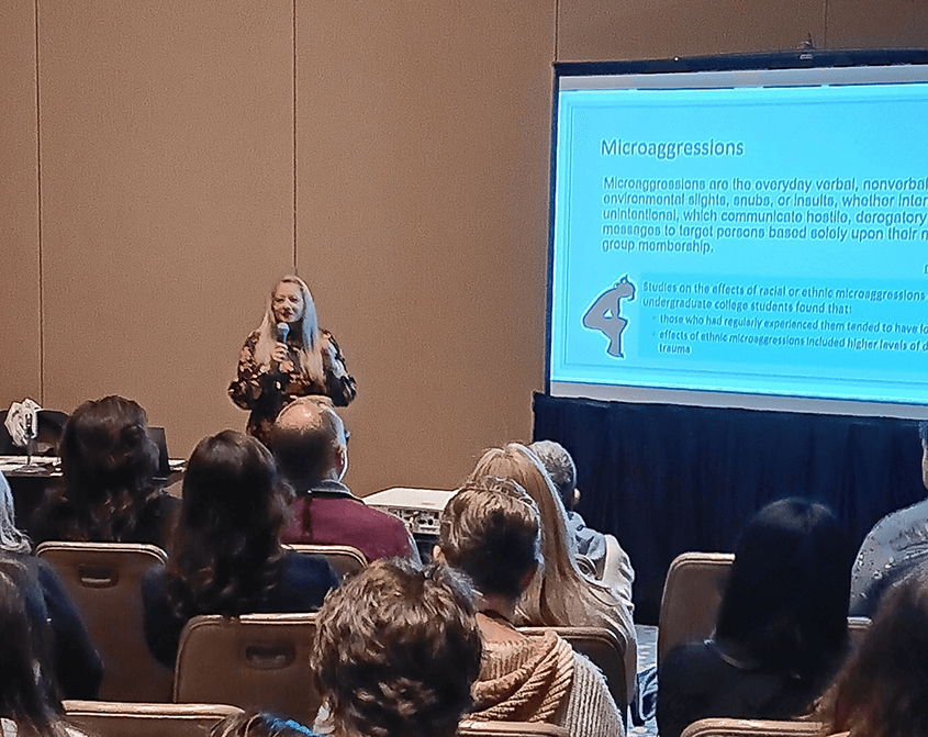 A professor speaking a the NAPAHE Conference in Washington, D.C.