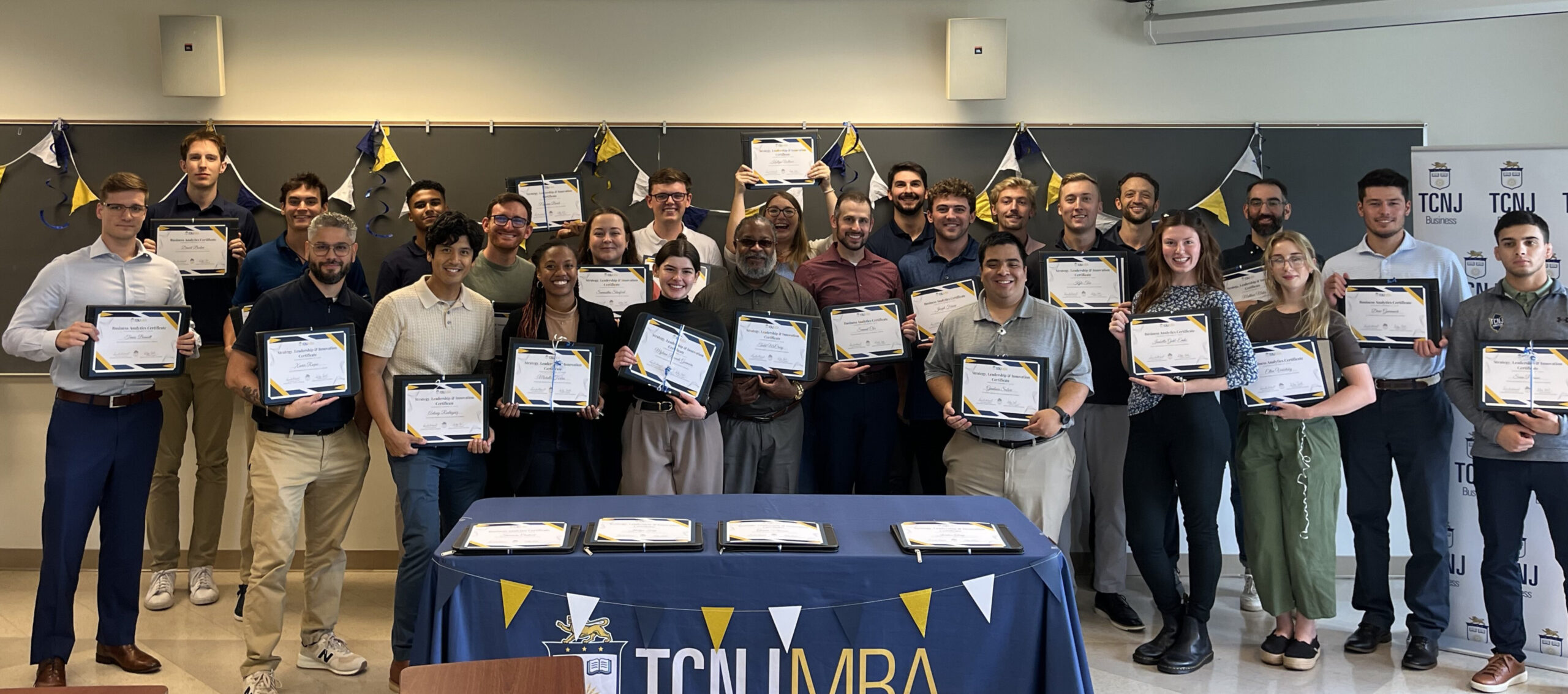 29 MBA Students with their certificates.
